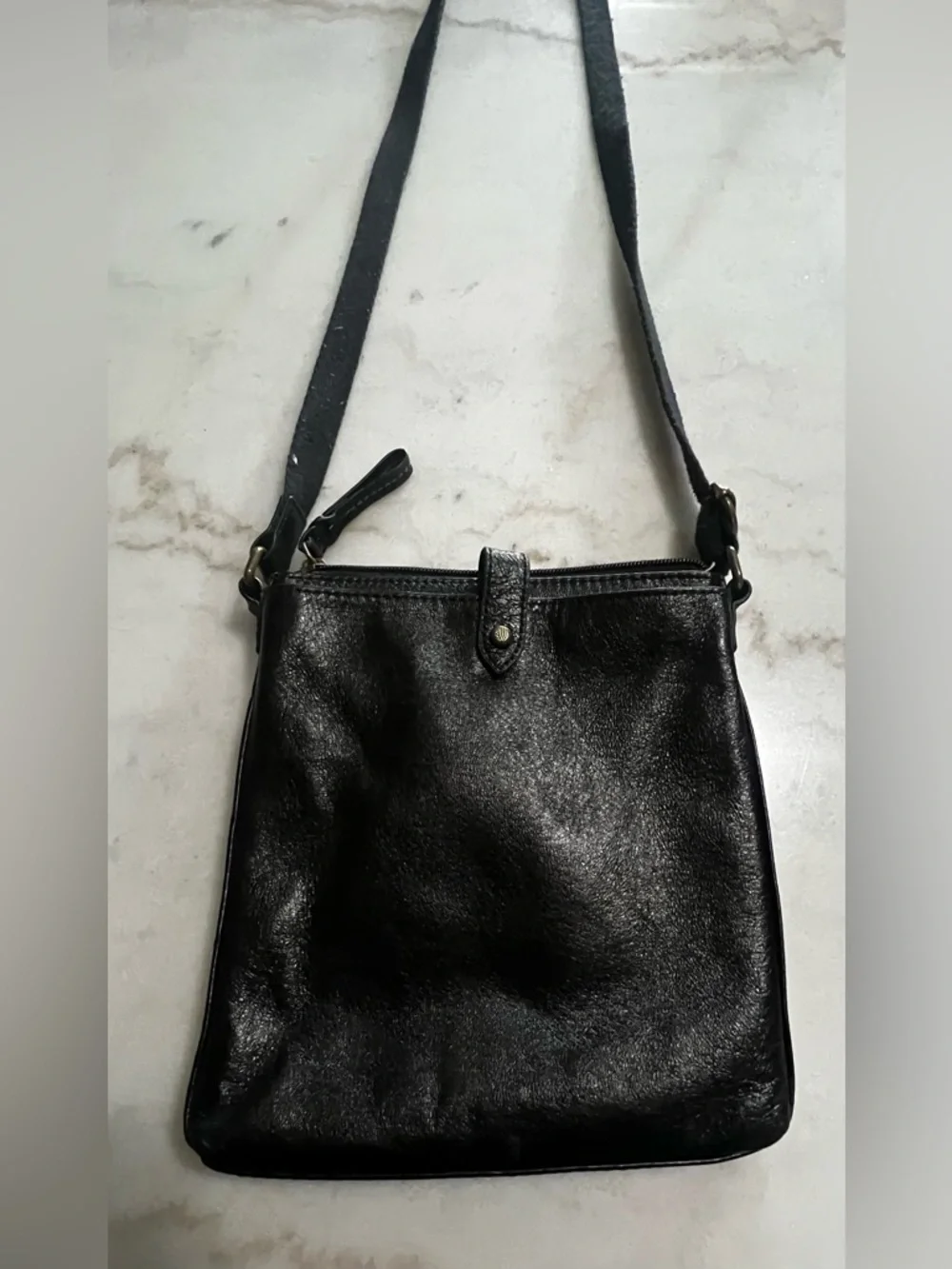 The Sak Black Leather Crossbody Bag with Gold Hardware And Colorful Lining